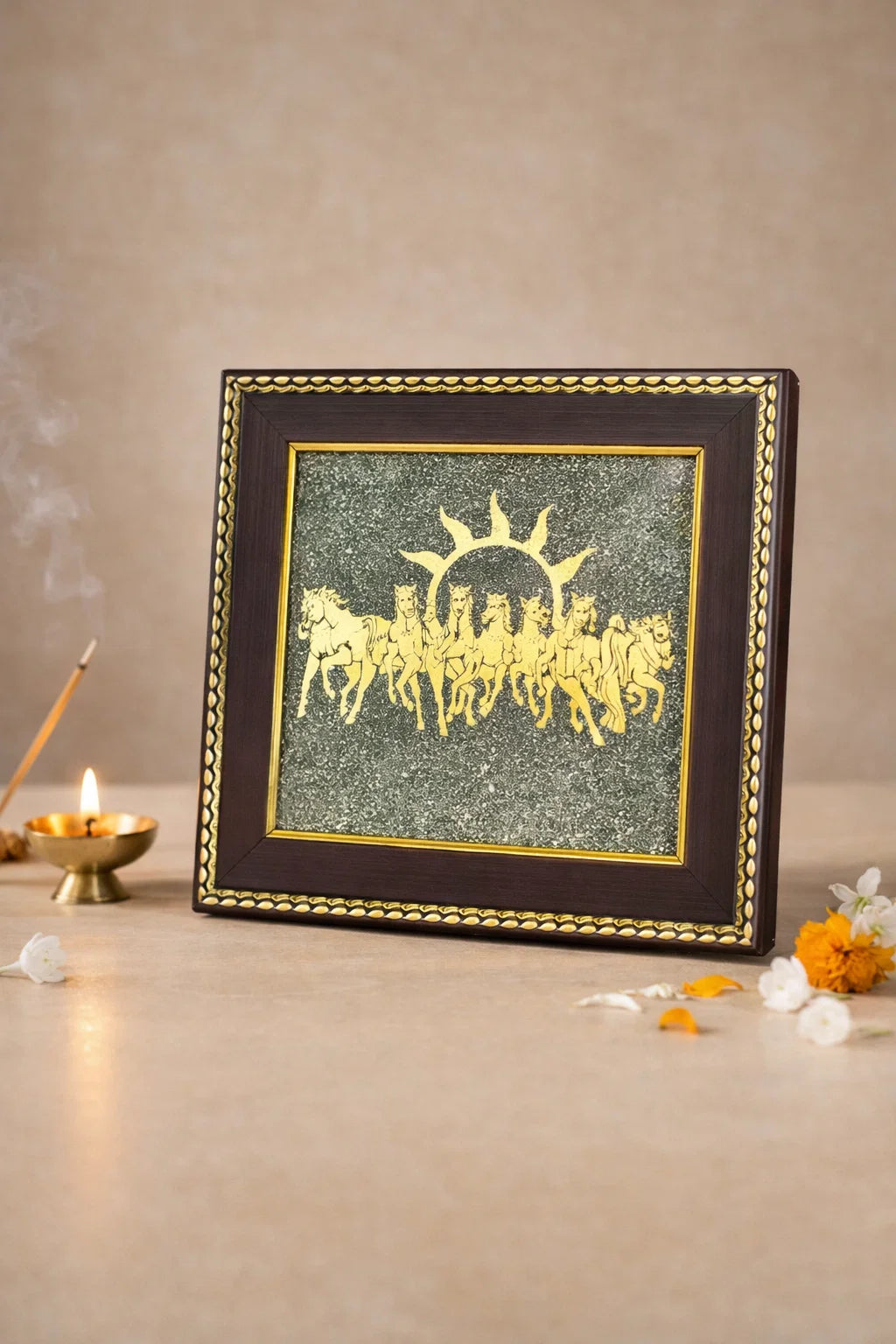 Framed artwork with a sun and chariot design on a beige background