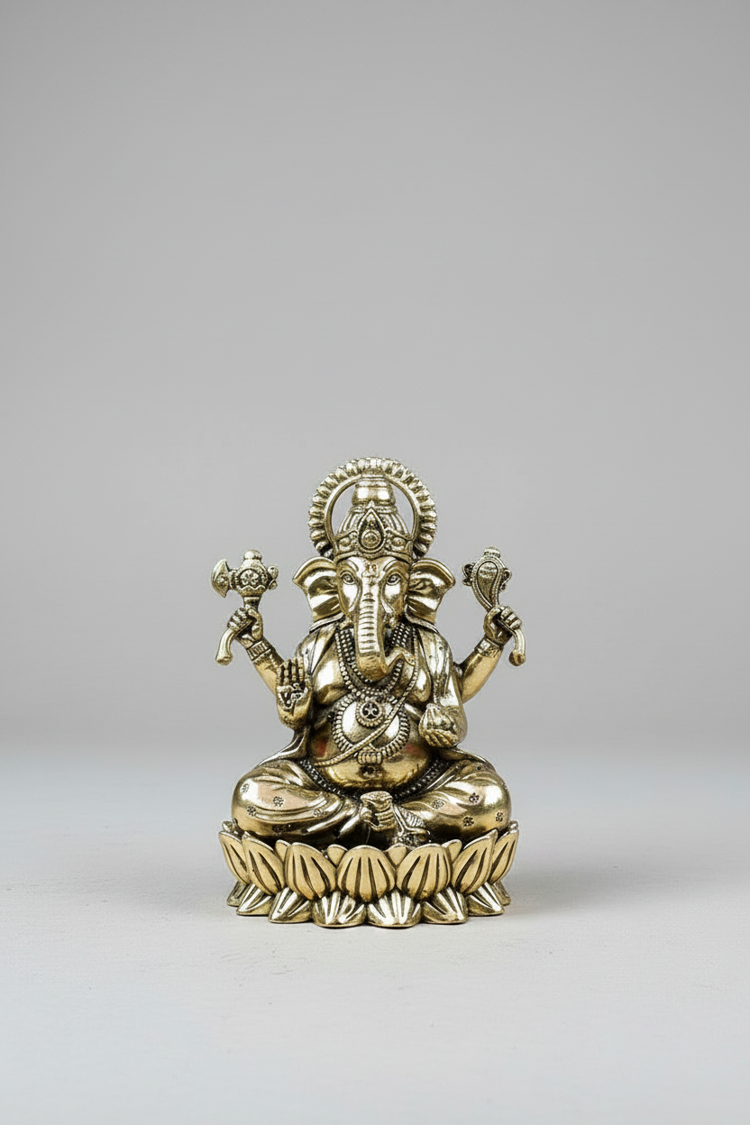 Gold-colored statue of a deity on a gray background