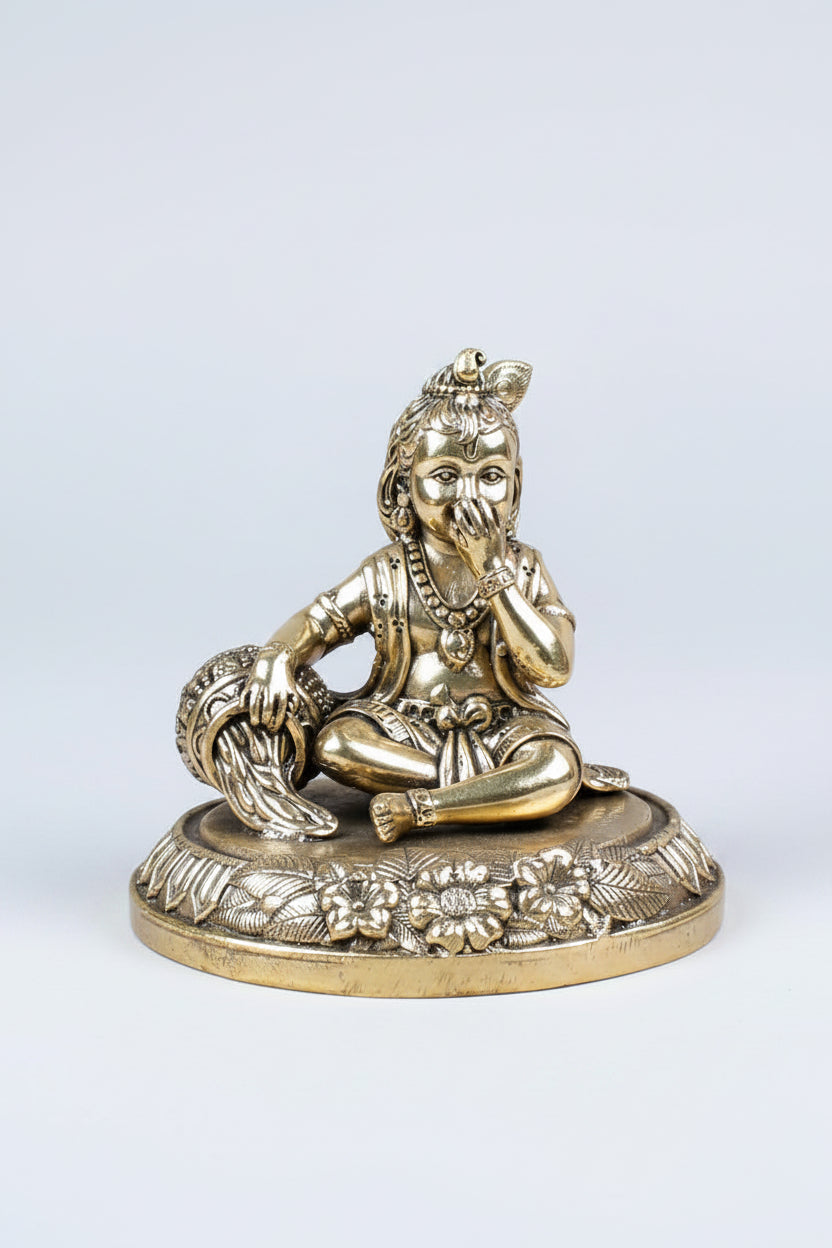 angle of the traditional Ashtadhatu Makhanchor Bal Krishna statue, displaying the detailed rear metal craftsmanship and divine crawling posture