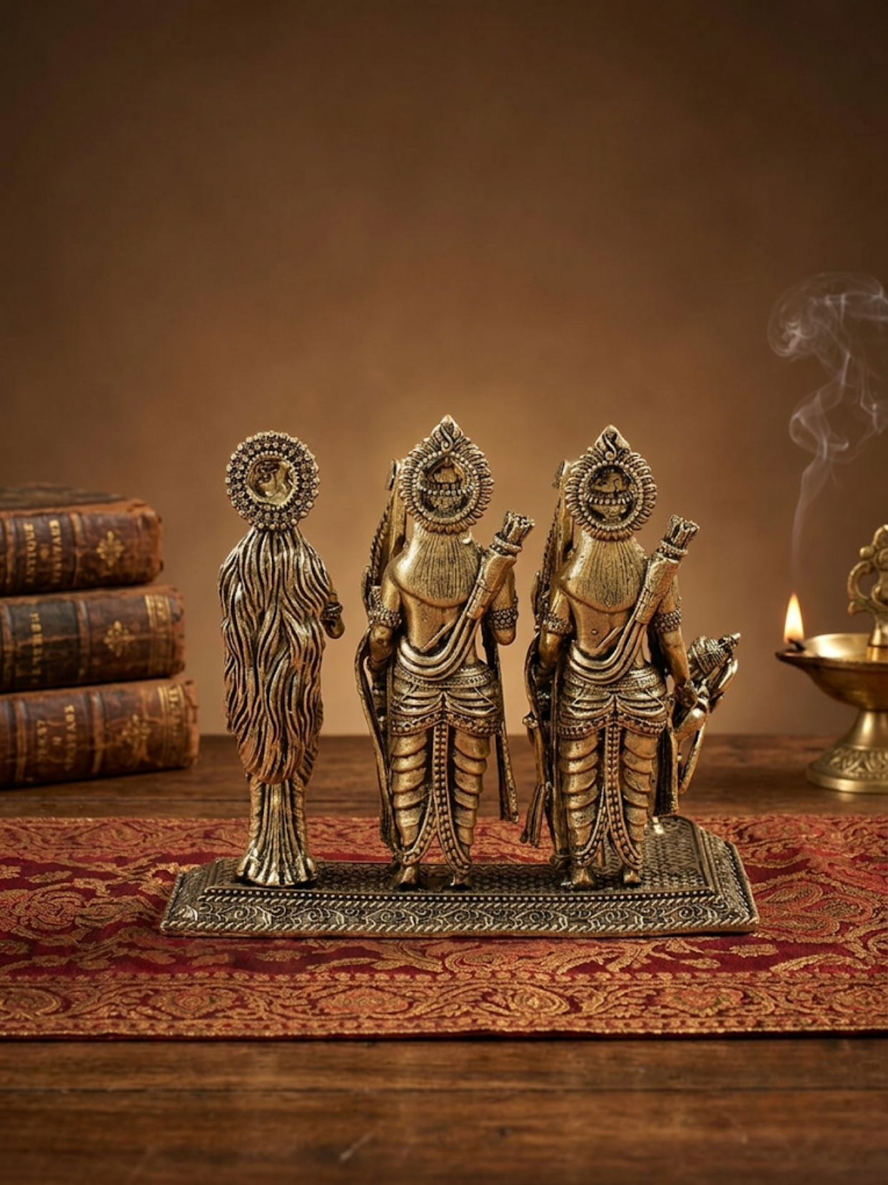 Ram Darbar Ashtadhatu Idol for home mandir, featuring the 8-metal statues on a textured surface with a candle in the background.