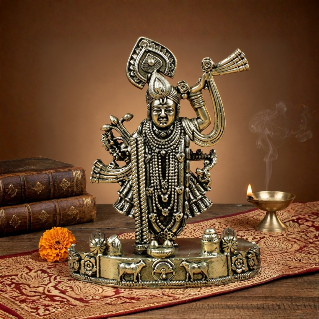 Front view of the Mani Monk Ashtadhatu Shreenathji idol, styled on a traditional pooja altar with incense and a lit diya