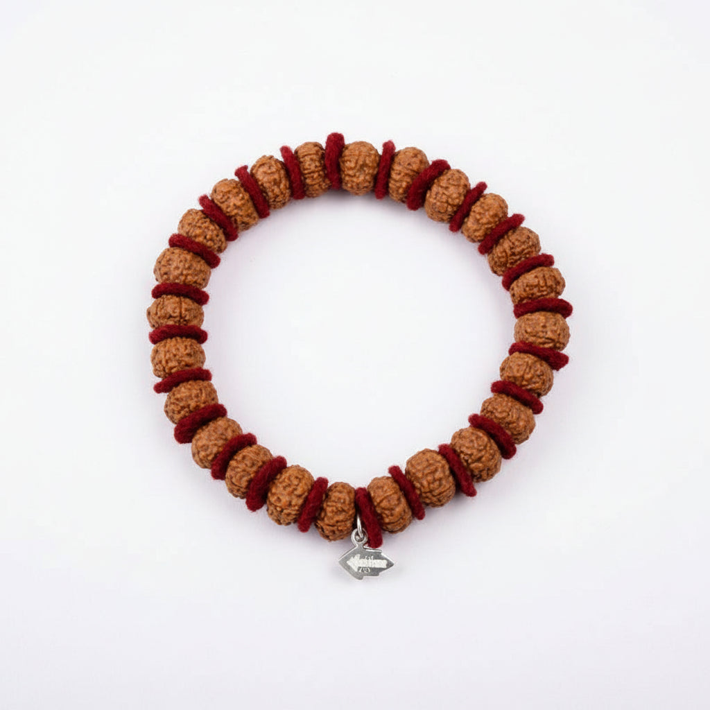 10 Mukhi Krishna Bracelet From Java In Woolen Spacers-10 mm