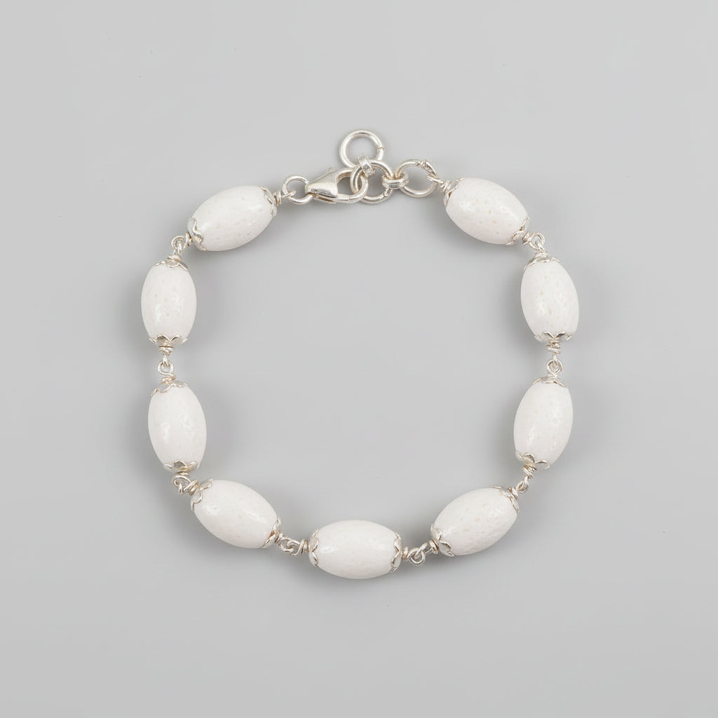 White Coral Drum Shape Silver Flower Caps Bracelet