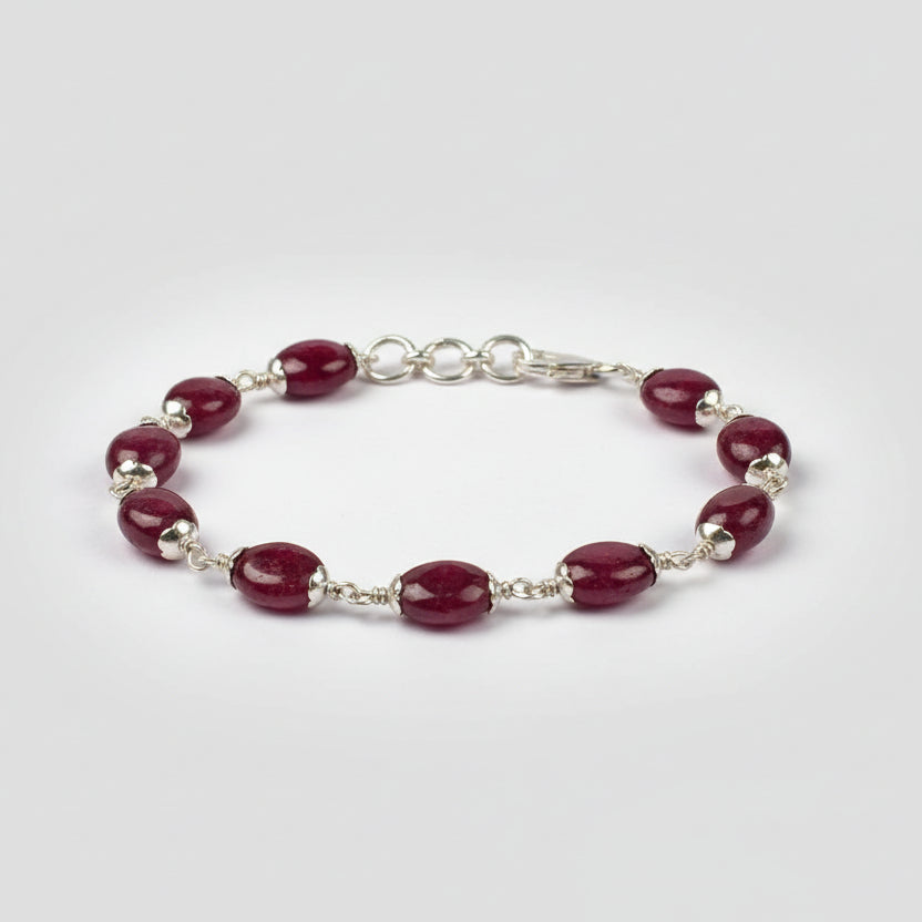 Ruby Oval Beads in Silver Flower Caps Bracelet