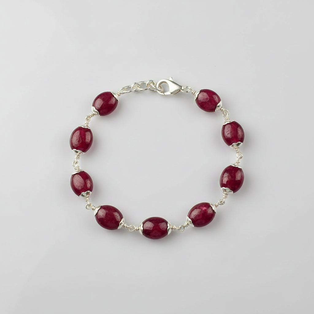 Ruby Oval Beads in Silver Flower Caps Bracelet