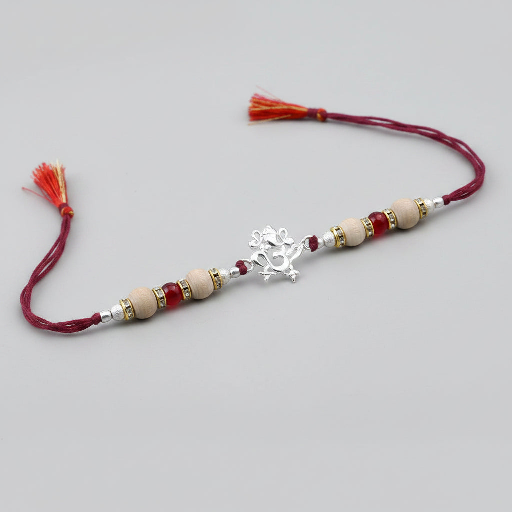OM Design Rakhi in Pure Silver with Sandalwood Bead in thread