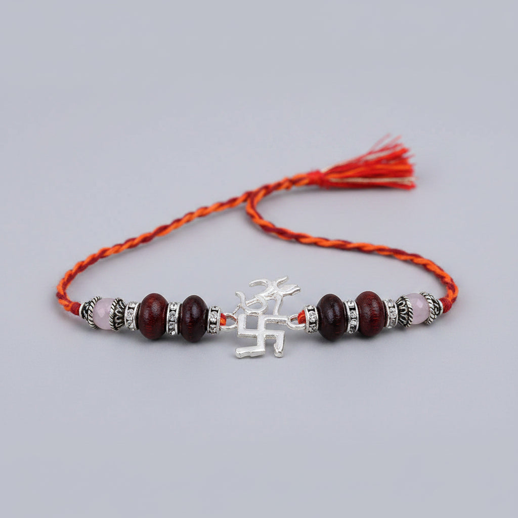 OM Design Rakhi in Pure Silver with Red Sandalwood Bead in thread