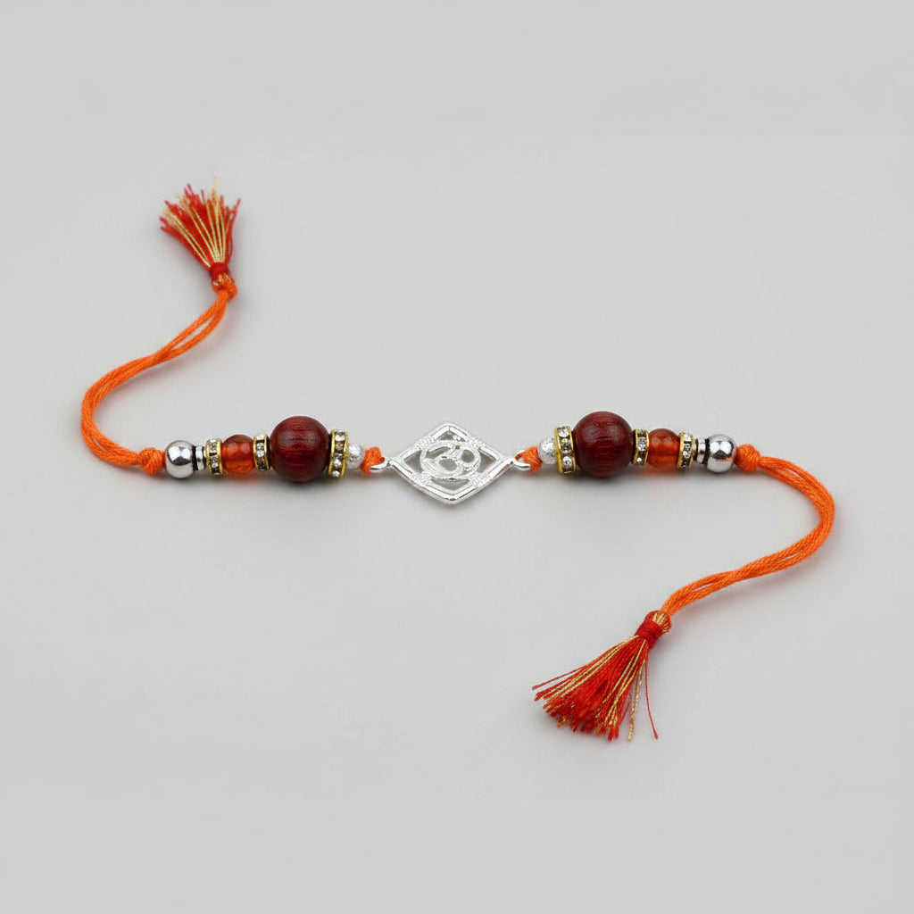 OM Design Rakhi in Pure Silver with Red Sandalwood Bead in thread - I