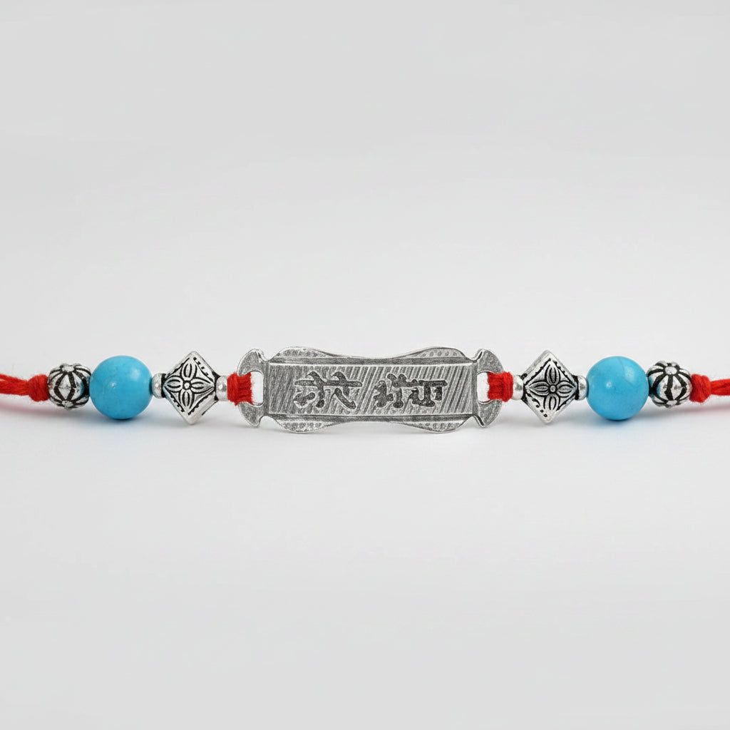 Turquoise beads Rakhi with pure silver accessories in thread